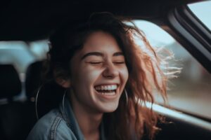 Best Audiobooks - A woman laughing in the car